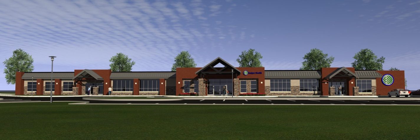 Color rendering of the Juniper Health Breathitt County clinic building exterior. Red brick, one-story, with multiple windows and entrances. Blue sky in the background, grassy area in the front. Some trees.